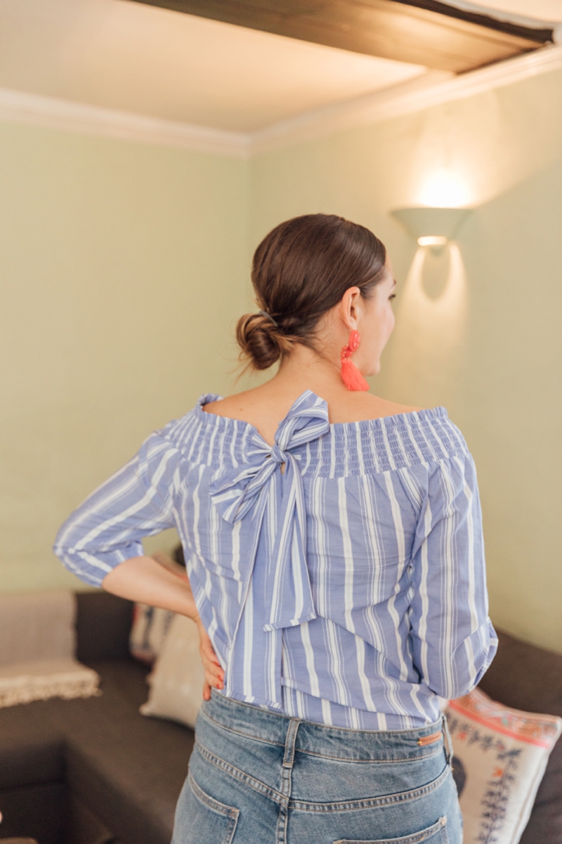 Pretty Low Chignon Hair Style Worn With Red Statement Tassel Earrings | Monica Beatrice Welburn | The Elgin Avenue Blog