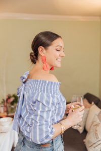 Pretty Low Chignon Hair Style Worn With Red Statement Tassel Earrings | Monica Beatrice Welburn | The Elgin Avenue Blog