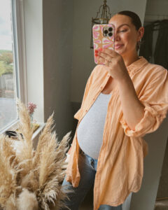 Monica Welburn-Leggett 31 week baby bump in jeans and grey vest top